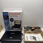Sylvania SDVD7014 Black 7" Lcd Screen Portable Player Used. Price: $39.99.